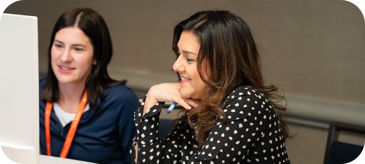 Two people working on a computer